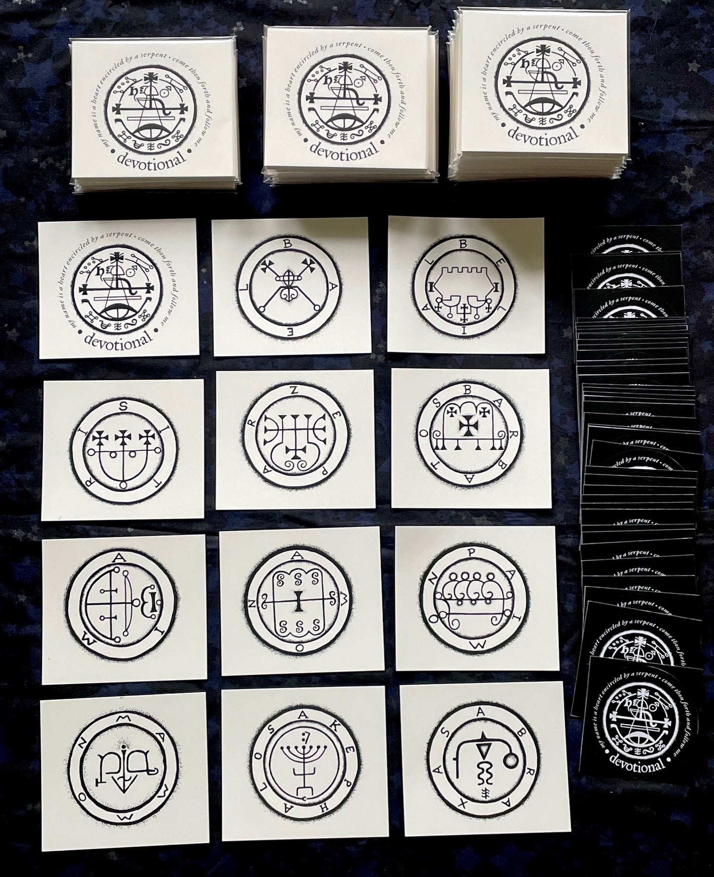 Collection of cards with circular designs on a dark textured surface