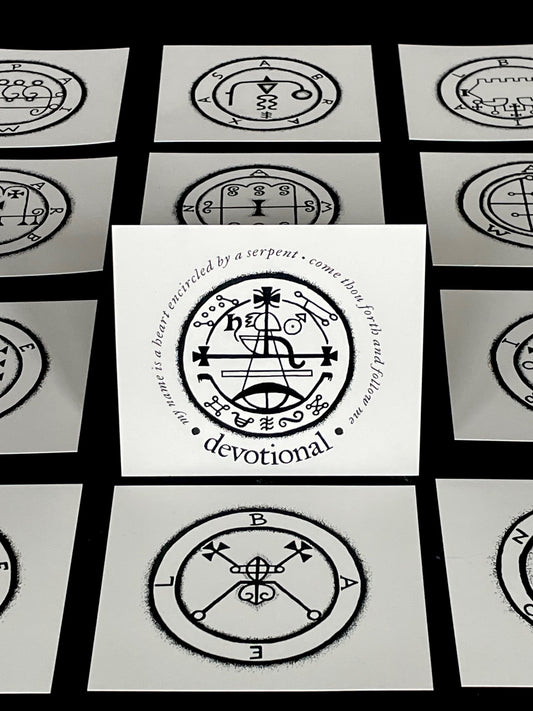 Set of cards with black and white symbols and text on a black background
