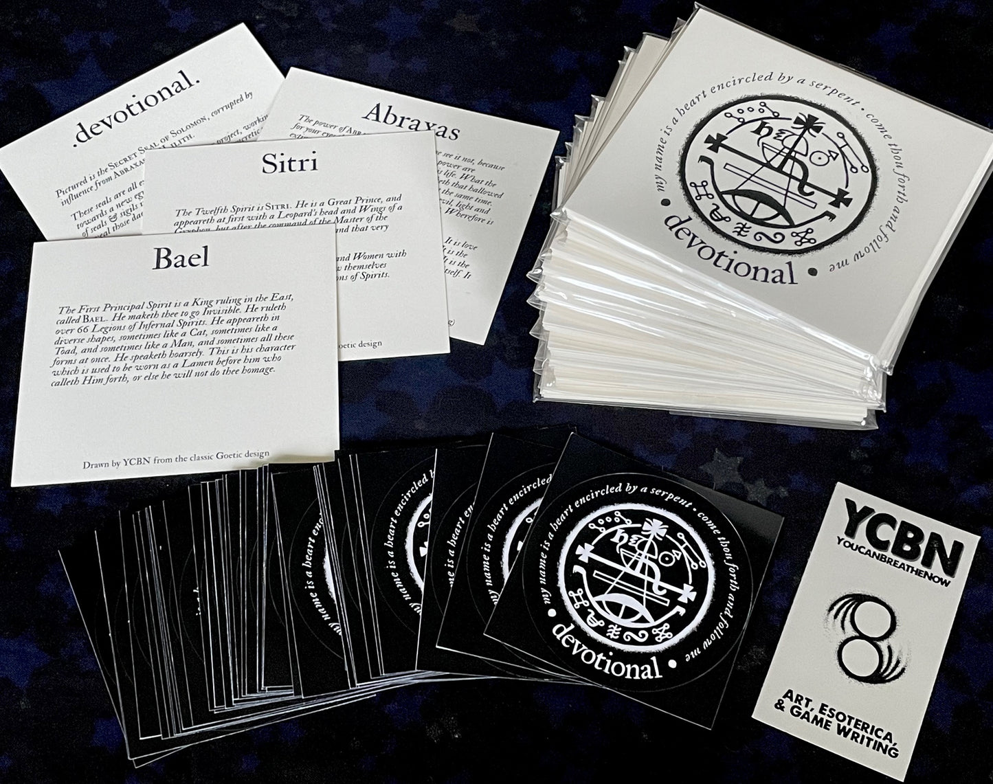 Collection of cards and stickers with text and logos on a dark background