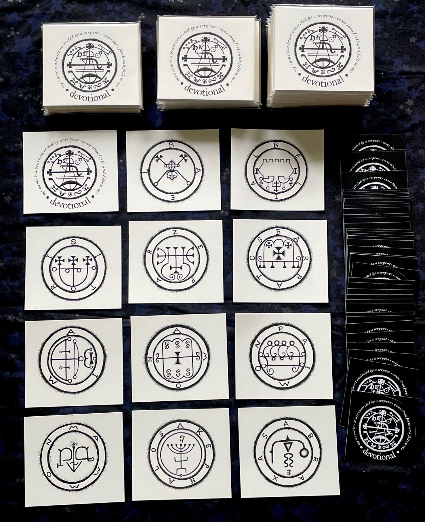 Collection of cards with circular designs on a dark textured surface